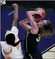  ?? CHARLIE RIEDEL — THE ASSOCIATED PRESS ?? Michigan center Izabel Varejao, left, gets past Tennessee center Kasiyahna Kushkituah (11) to put up a shot during Tuesday’s game in the second round of the women’s NCAA tournament at the Alamodome in San Antonio.