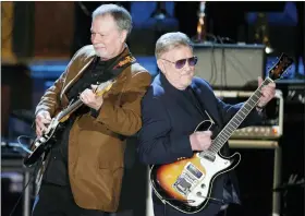  ?? JASON DECROW—ASSOCIATED PRESS ?? Bob Spalding, left, and Don Wilson of The Ventures perform at the Rock and Roll Hall of Fame Induction Ceremony in New York, March 10, 2008.