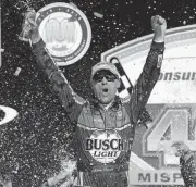  ?? [AP PHOTO] ?? Kevin Harvick celebrates his victory after the NASCAR Cup Series race Sunday at Michigan Internatio­nal Speedway in Brooklyn, Mich.