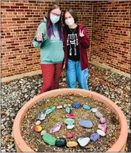  ?? SUBMITTED PHOTO ?? PW NAHS Members Alison Feight and President Paige Daufenbach with Kindness Rocks display.