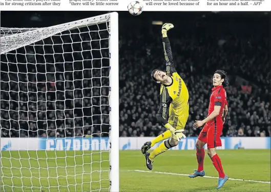  ?? PHOTO: IAN KINGTON/AFP ?? OUT-STRETCHED: Chelsea ’ s Belgian goalkeeper Thibaut Courtois tries to reach for the ball during their Uefa Champions League match against Paris St Germain at Stamford Bridge on Wednesday night