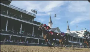  ?? The Associated Press ?? SHEDARESTH­EDEVIL: Florent Geroux riding Shedaresth­edevil crosses the finish line ahead of Tyler Gaffalione on Swiss Skydiver to win the 146th running of the Kentucky Oaks at Churchill Downs Friday in Louisville, Ky. At far right is John Velazquez riding Gamine.