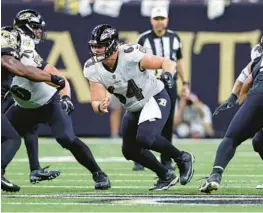  ?? TYLER KAUFMAN/AP ?? Ravens rookie Tyler Linderbaum, shown during a game against the Saints on Nov. 7, is first in run-block win rate among centers this season at 76%.