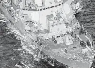  ?? AP/Kyodo News/HITOSHI TAKANO ?? This aerial view shows the damage to the USS Fitzgerald as the destroyer makes its way to Yokosuka Naval Base on Saturday.