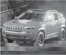  ?? Carlos Osorio / Associated Press ?? The 2019 Jeep Cherokee has a larger grille, combining LED headlamps and daytime running lights.