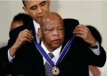  ??  ?? John Lewis with Barack Obama and (below) Elijah Cummings (Getty/Reuters)