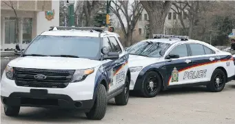  ?? GORD WALDNER/The StarPhoeni­x ?? The new Saskatoon police vehicles — Ford Explorer SUVs and Taurus sedans — have new paint colour
scheme and decals. The old fleet is to be phased out over the next few years.