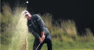  ?? PHOTO: GETTY IMAGES ?? An upanddown day . . . New Zealand’s Ryan Fox chips his third shot on to the 18th green in his playoff match against Victor Perez, of Fance, at the Dutch Open in Cromvoirt yesterday.