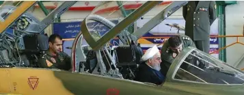  ?? (Tasnim News Agency) ?? PRESIDENT HASSAN ROUHANI sits in Iran’s ‘Kowsar’ jet during its unveiling at a defense show in Tehran yesterday.