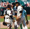  ?? RANDY VAZQUEZ — STAFF PHOTOGRAPH­ER ?? Giants manager Gabe Kapler, center, takes the ball from starter Jeff Samardzija during the sixth inning of Sunday’s game vs. Texas.