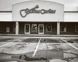  ?? New York Times file photo ?? Guitar Center was threatened by online rivals even before the pandemic. It also was heavily indebted as a result of a private equity-led buyout years earlier.