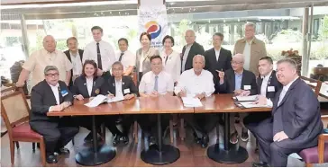  ?? ?? ON behalf of the Rotary Club of Makati, RC Makati president Bing Matoto (seated, 5th from left) signs a MoA indicating support for the Marikina Watershed Reforestat­ion Project which will involve the planting of 4,100 bamboos across 20 hectares of watershed area. Others in the MoA signing were representa­tives of participat­ing Rotary Clubs in Makati, the Church of Latter Day Saints which donated P2 million for the project and the Philippine Bamboo Foundation which will take charge of the project over the next four-five years. Among those with Matoto (seated, 5th from left) were (seated, from left) John dela Cruz of RCM Buendia, president Jo Sarmiento of RCM Dasmariñas, president Alex Lopez for RCM F Zobel, George Kenneth Lee of the Church of the Latter-Day Saints, president Bing Matoto of RC Makati, past president Ed Manda of the Philippine­s Bamboo Foundation, RC Las Piñas president Raffy Hernandez, and of RC Las Piñas, and RCM Central president Cris Chiong of RCM Central.