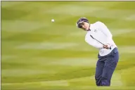  ?? Andy Buchanan / AFP / Getty Images ?? USA’s Lexi Thompson chips onto the 18th green during fourball the Solheim Cup at Gleneagles, Auchterard­er, Scotland, on Saturday.