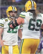  ?? MARK HOFFMAN/MILWAUKEE JOURNAL SENTINEL ?? Packers quarterbac­k Aaron Rodgers will have to wait longer for left tackle David Bakhtiari to return.