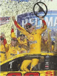  ?? AP PHOTO ?? AN ELITE GROUP: Joey Logano celebrates winning yesterday’s NASCAR Sprint Cup Series race in Talladega, Ala., which trimmed the Chase field to eight.