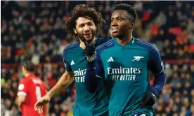  ?? ?? Arsenal's Eddie Nketiah celebrates with Mohamed Elneny after scoring in the 1-1 draw against PSV Eindhoven. Photograph: Piroschka van de Wouw/Reuters