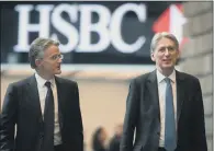  ?? PICTURE: STEFAN ROUSSEAU/PA WIRE ?? GLOBAL UNCERTAINT­Y: HSBC chief executive John Flint, left, is pictured with Chancellor Philip Hammond.