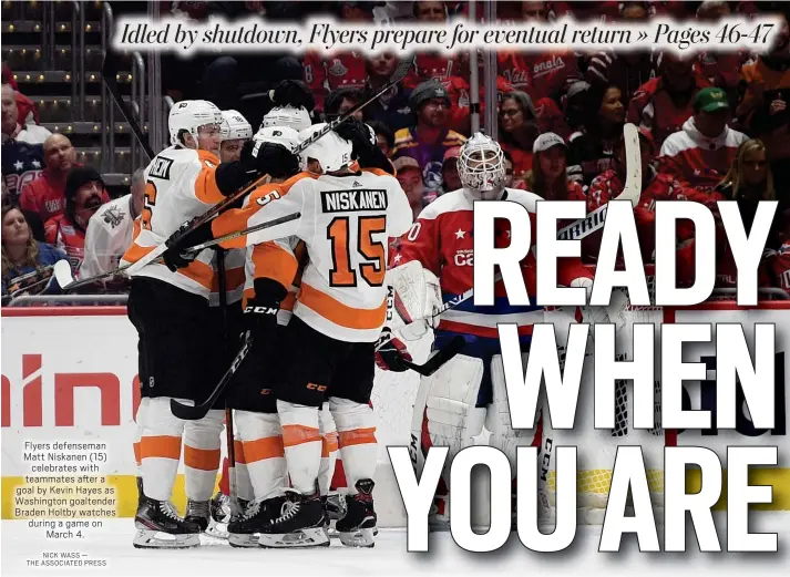  ?? NICK WASS —
THE ASSOCIATED PRESS ?? Flyers defenseman Matt Niskanen (15)
celebrates with teammates after a goal by Kevin Hayes as Washington goaltender Braden Holtby watches during a game on
March 4.