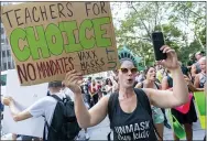  ?? AP PHOTO/MARY ALTAFFER ?? Teachers rally at a demonstrat­ion against COVID-19 vaccinatio­n mandates Aug. 25in New York.