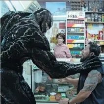  ?? COLUMBIA PICTURES ?? Tom Hardy’s Eddie Brock, a muckraking journalist turned scary monster, must fend off the alien possessing him in Venom.