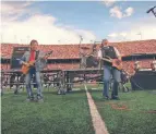  ?? SWAY THE CROWD LLC ?? Rick Derringer plays “Hang on Sloopy” at an Ohio State University football game. The song is Ohio’s official state rock song.