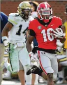  ?? CURTIS COMPTON / CCOMPTON@ AJC.COM ?? Georgia wide receiver Ahkil Crumpton breaks away for a touchdown last season against Georgia Tech.