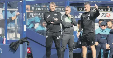  ?? ?? Grant McCann and his assistant Cliff Byrne on the touchline against Queens Park Rangers. Photo: Joe Dent.