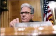  ?? THE ASSOCIATED PRESS ?? Sen. Tom Coburn, R-Okla. requested a Government Accountabi­lity Office report which showed nearly 60,000 veterans collected more than $3.5 billion in 2013in military retirement pay, disability benefits from Veterans Affairs and disability checks from...