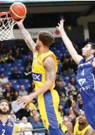  ?? (Danny Maron) ?? MACCABI TEL AVIV forward Scottie Wilbekin scores two of his 12 points in the yellow-andblue’s 88-70 victory over visiting Bnei Herzliya on Sunday night in BSL action.