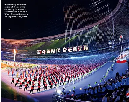  ?? ?? A sweeping panoramic scene of the opening ceremony for China’s 14th National Games in Xi’an, Shaanxi Province, on September 15, 2021.