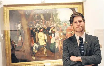  ??  ?? Councillor Ben Lawrie beside one of the paintings by Pieter Brueghel the Younger.