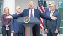  ?? ALEX WONG/GETTY ?? President Donald Trump speaks in the White House Rose Garden on Friday, joined by members of his Cabinet.