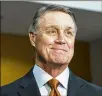  ?? ALYSSA POINTER / ALYSSA.POINTER@AJC.COM ?? Some conservati­ves in Georgia threatened to pull support for U.S. Sen. David Perdue if he backs a “red flag” proposal.