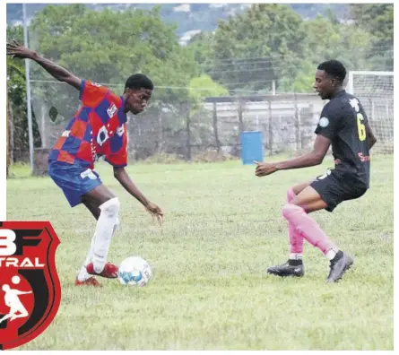  ?? (Photo: Dwayne Richards) ?? Camperdown High’s Shelton Ricketts (left) attempts to dribble by Mona High’s Damoi Whitfield during their Manning Cup match at Mona High on Tuesday. Mona High won 9-2.