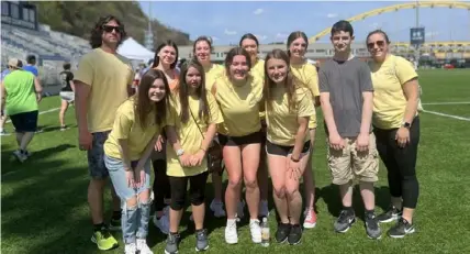  ?? Jane Milner photos ?? The Thomas Jefferson High School Best Buddies attend the recent Best Buddies Friendship Walk at Highmark Stadium on the South Side. From left, back row: health and physical education teacher Michael Rose, Lily Scarantino, Graci Fairman, Emma Pritchard, Nicole Narr, Owen Yanovich and life skills teacher Emily Leininger; front row: Grace Vogtsberge­r, Ariann Downer, Charlotte Rockwell and Kaylee Rehak.