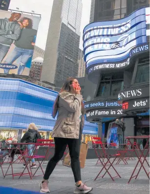  ??  ?? Fears over coronaviru­s dominated the news in the United States and left New York’s Times Square quiet yesterday.