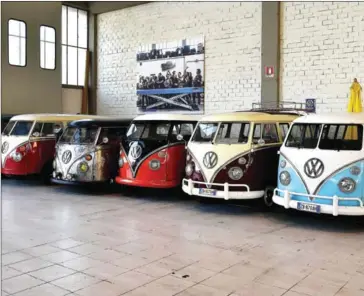  ?? ALBERTO PIZZOLI/AFP ?? Vintage Volkswagen Kombis (van, transporte­r or camper) are parked in a garage after being completely restored by mechanics of the ‘T1 specialist’ company, on November 3 in Florence. Campers like the legendary VW Bulli, Samba or Splitties sometimes come...