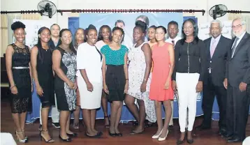  ??  ?? IGL Medical and Nursing scholars get together for a photo op at the Ignite IGL Foundation Annual Scholarshi­p and Bursary Awards Ceremony, held at Alhambra Inn. They are joined by Wayne Kirkpatric­k (third from left), general manager, IGL Ltd.; Sharon...