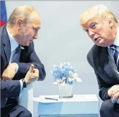  ?? AP PHOTO ?? In this July 7, 2017, file photo, U.S. President Donald Trump meets with Russian President Vladimir Putin at the G-20 Summit in Hamburg.