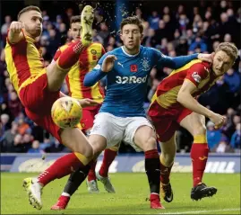  ??  ?? GOSH, JOSH: Windass, who scored Rangers’ third goal, takes on the Thistle defence