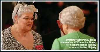  ??  ?? HONOURED: Penny Jones receives her MBE from the Queen – her husband Ron is partially obscured by Her Majesty