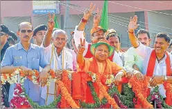  ?? PTI ?? ▪ Chief minister Yogi Adityanath during a roadshow ahead of Karnataka Assembly elections in Bantwal on Thursday.