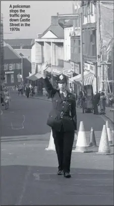  ??  ?? A policeman stops the traffic going down Castle Street in the 1970s