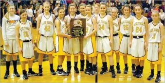  ?? MARK HUMPHREY ENTERPRISE-LEADER ?? The Prairie Grove junior high girls basketball team won the second-place trophy at the district tournament, which they hosted on Feb. 9.