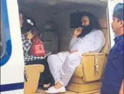  ?? HT PHOTO ?? Dera Sacha Sauda chief Gurmeet Ram Rahim Singh in a chopper on way to Rohtak on Friday.