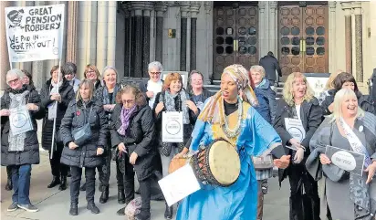  ??  ?? Pension campaigner­s celebrate outside London’s Royal Courts of Justice yesterday after the hearing