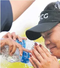  ??  ?? Ariya gets doused with water after winning the US Women’s Open in Alabama.
