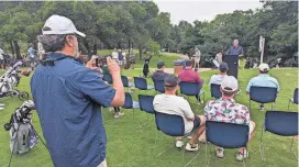  ?? TIM SCHMITT/GOLFWEEK ?? Golfers look on while Steve Hammond of Austin’s Parks and Recreation Department reads a proclamati­on from Mayor Kirk Watson on the 125th anniversar­y of Hancock Golf Course.