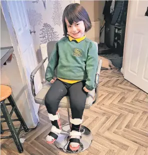 ?? ?? Forging ahead Ella with her special ankle foot orthosis (AFO) equipment