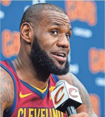  ?? JASON MILLER, GETTY IMAGES ?? LeBron James said on Monday that “people find teams, people find players, people find colors because of sport ... and it brings people together like none other.”